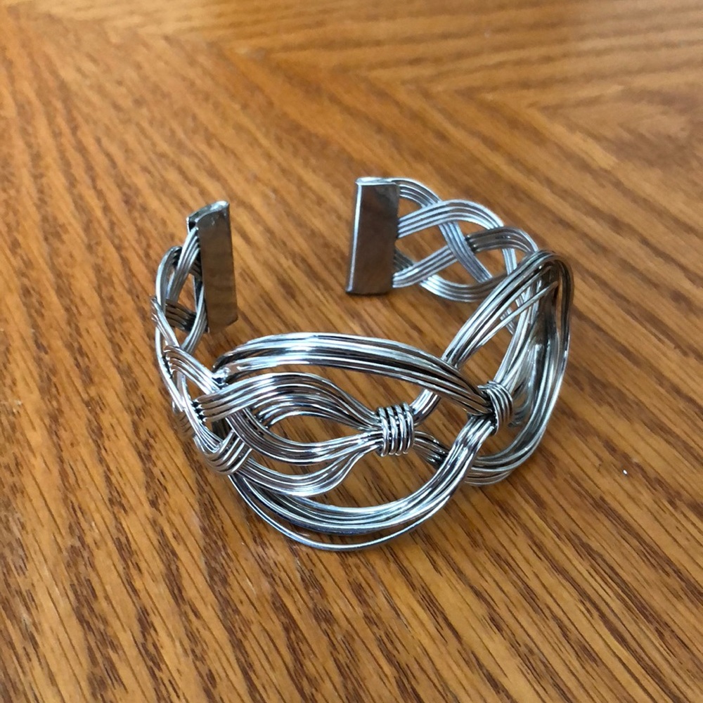 Silver tone bangle bracelet.